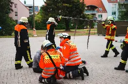 firemen performing drill outdoors